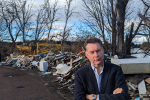 Murdo Fraser MSP beside fly-tipping near the River Tay