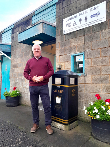 Councillor Keith Allan beside the public toilets in Auchterarder 