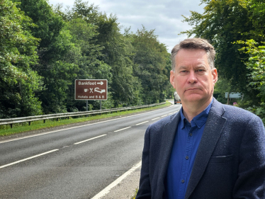 Murdo Fraser beside the A9.